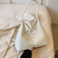 Brown retro-style PU leather pillow-shaped shoulder handbag with a single strap.