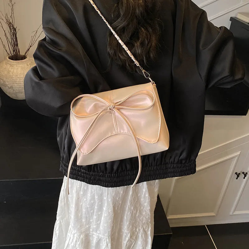 Women's black PU crossbody underarm bag with horizontal square shape and visible sewing line detailing
