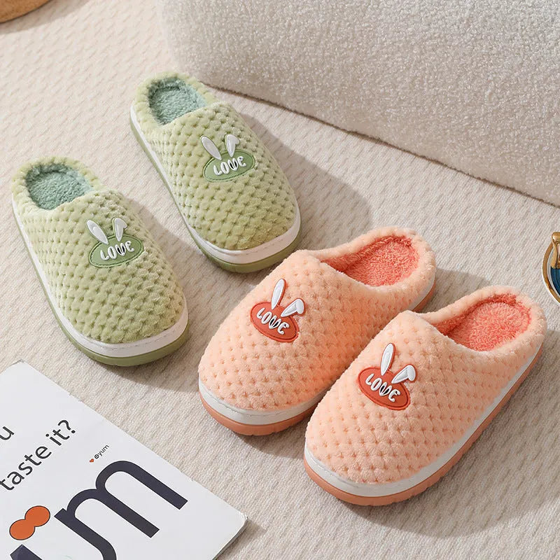 Women's rabbit plaid artificial fur slippers with a thick rubber sole in apricot colour.
