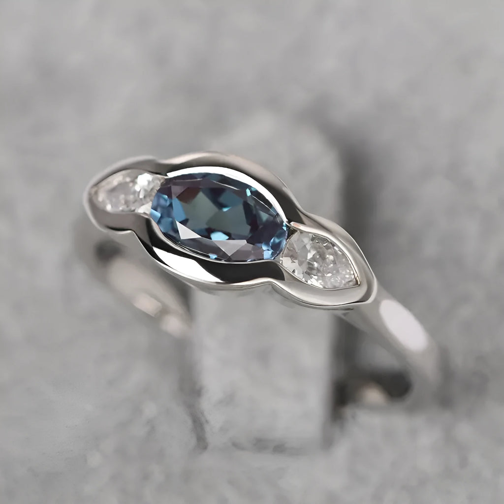 Geometric ellipse women's ring with zircon centre stone in white gold colour