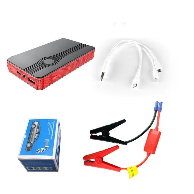 Red K4-E automobile emergency starting power supply unit with a data cable on a surface.