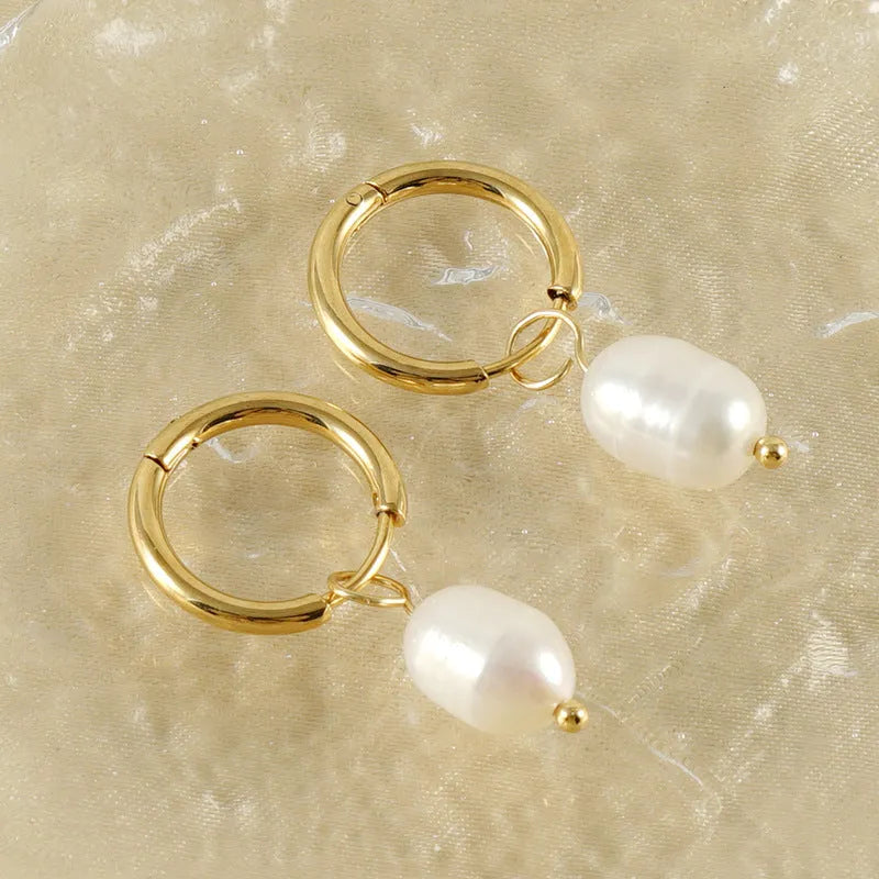 Gold-coloured geometric pearl earrings with stainless steel construction and titanium posts