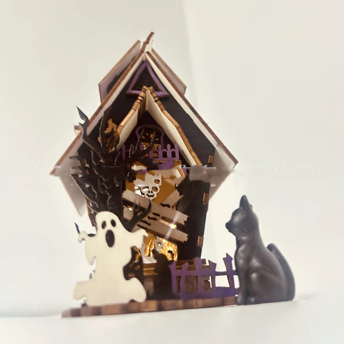 Wooden haunted house Halloween table decoration with luminous finish