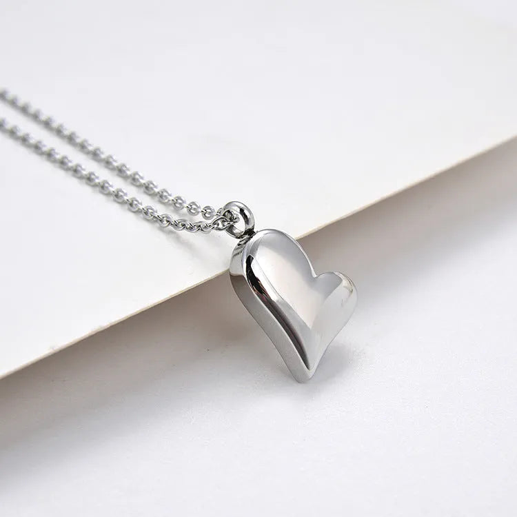 Silver stainless steel necklace with heart pendant on adjustable chain