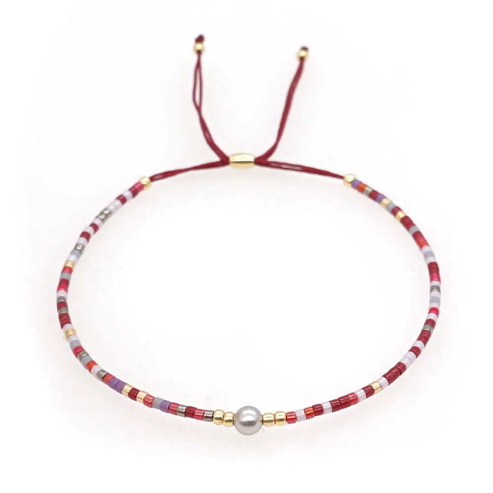 Handmade bohemian bracelet with colourful geometric glass beads in semi-precious stone style