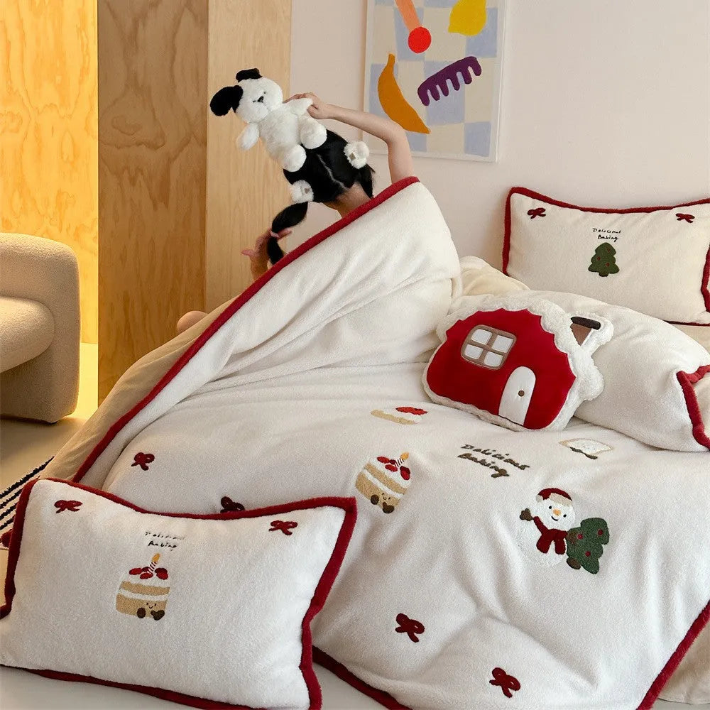 Girl's Christmas-themed heart cartoon pattern bedding four-piece set with a duvet cover, sheet, and pillowcases.