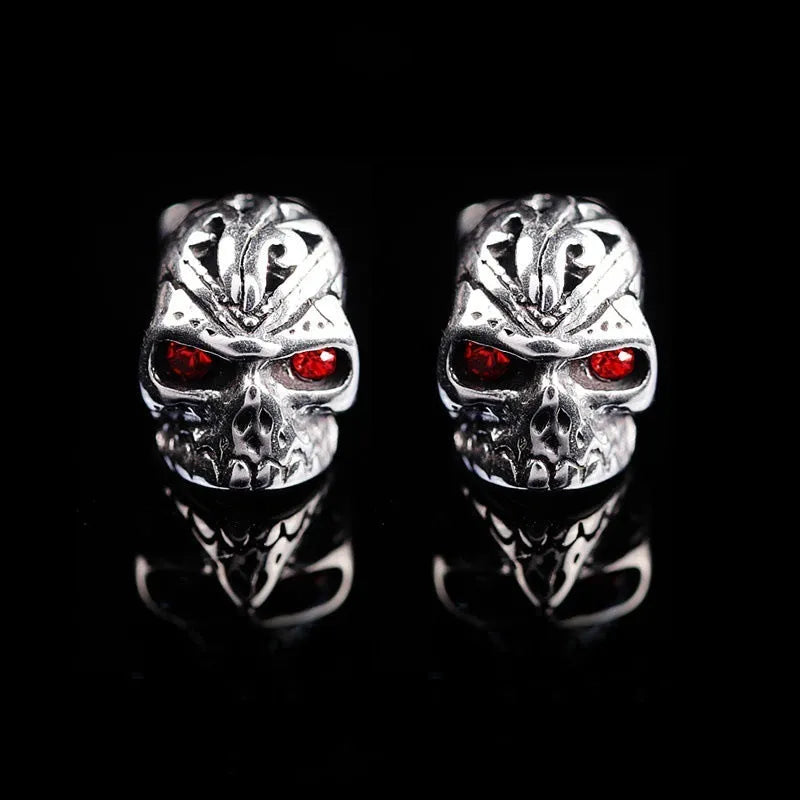 Retro skull stud earrings with red eye detailing and artificial gemstone inlay on alloy metal