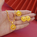 Gold-plated three-piece jewellery set with floral pendant design including necklace, earrings and ring