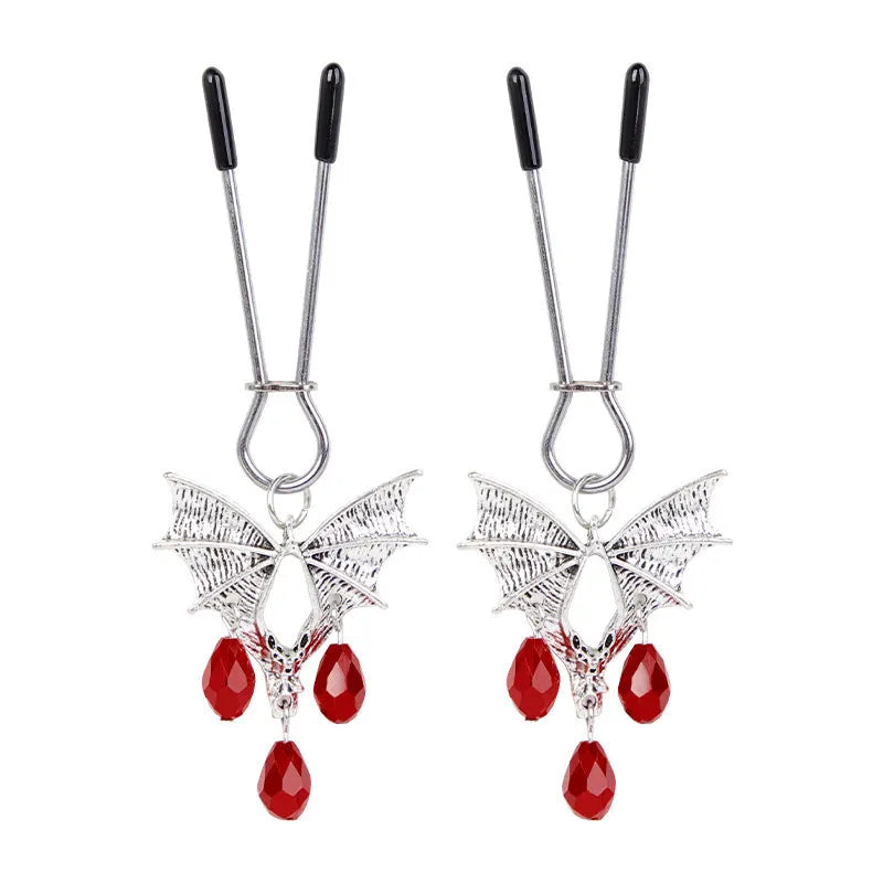 Silver coloured alloy bat-shaped nipple clamp with an adjustable screw mechanism.
