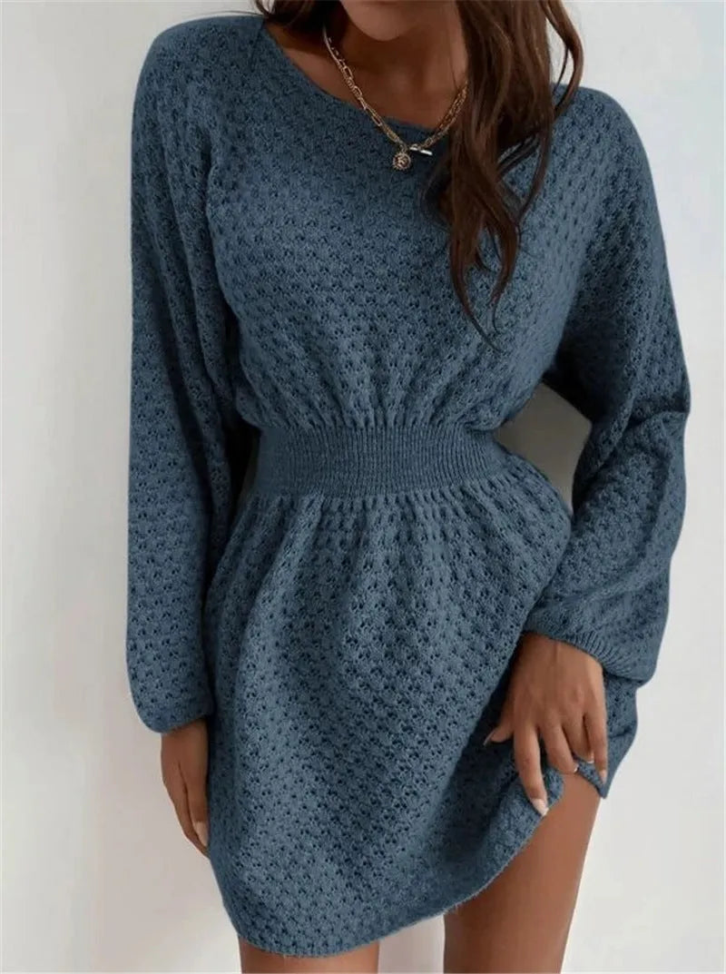 Blue women's knitted sweater dress with hand-crocheted flowers and a fitted waist.