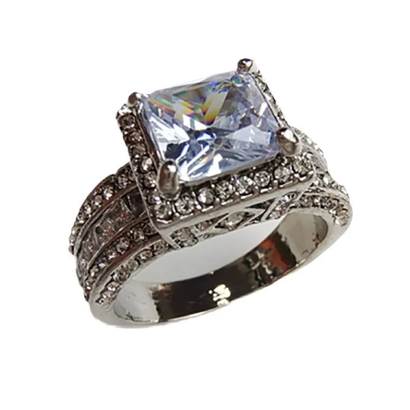 Geometric round design women's engagement ring in gold or white colour with angular patterns