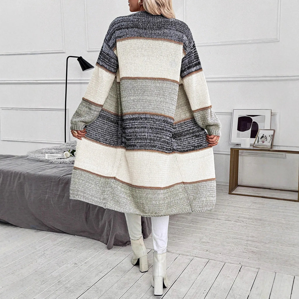 Grey knitted women's cardigan with loose fit design and long sleeves