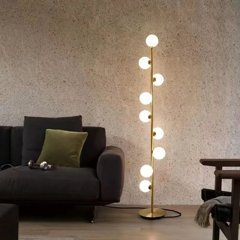 Minimalist modern floor lamp with wrought iron frame, glass elements, and marble base showing height and design details