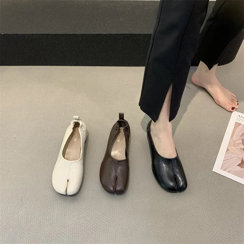 Women's black low heel pumps with split toe design and chunky heel