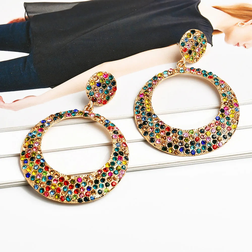 Coloured alloy metal earrings with large round diamond pendant in cartoon style design