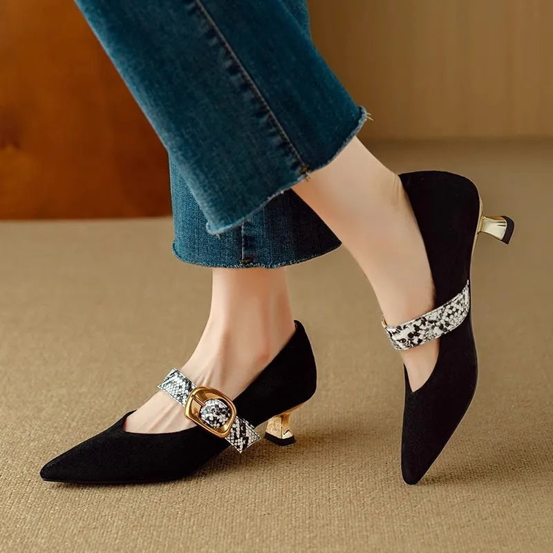 Black French pointed stiletto high heels for women with a buckle strap across the instep.