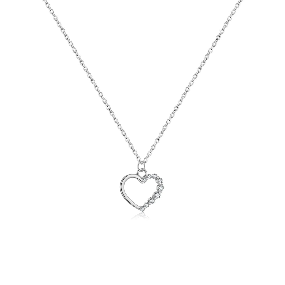 Sterling silver hollow heart necklace with circle elements, available in gold or platinum plating