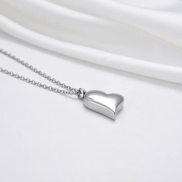 Silver stainless steel necklace with heart pendant on adjustable chain