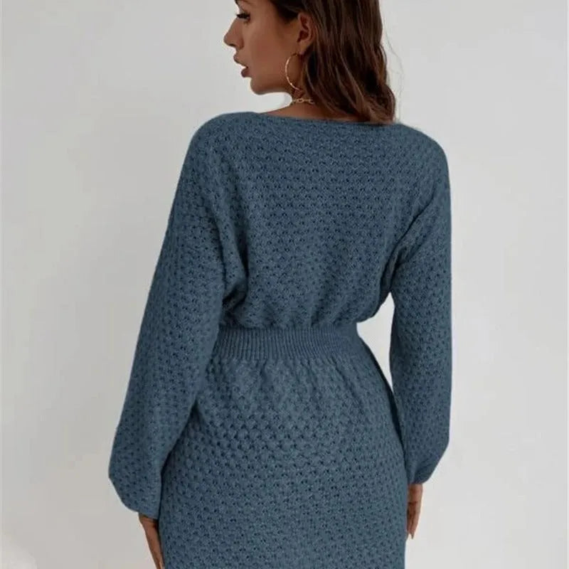 Blue women's knitted sweater dress with hand-crocheted flowers and a fitted waist.