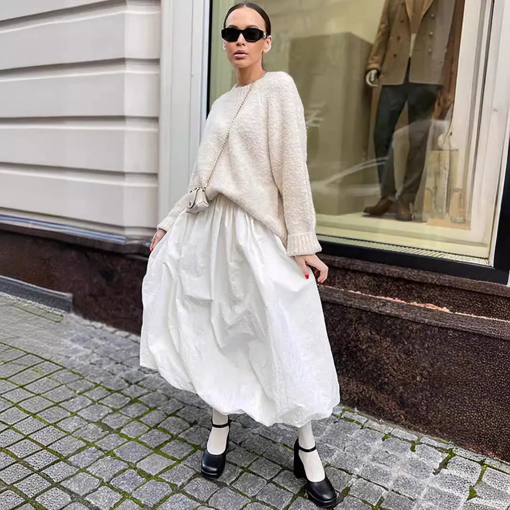 Women's long cotton skirt in solid black or white colour for casual wear.