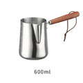 Stainless steel coffee cup with wooden handle and internal measuring scale.