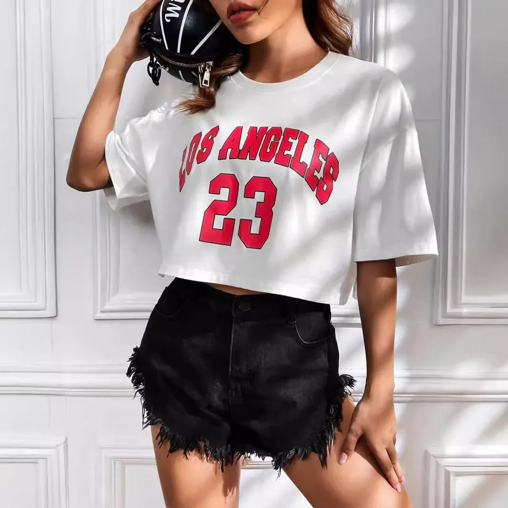 A loose fit black cotton T-shirt with white printed English letters and an exposed navel cut.
