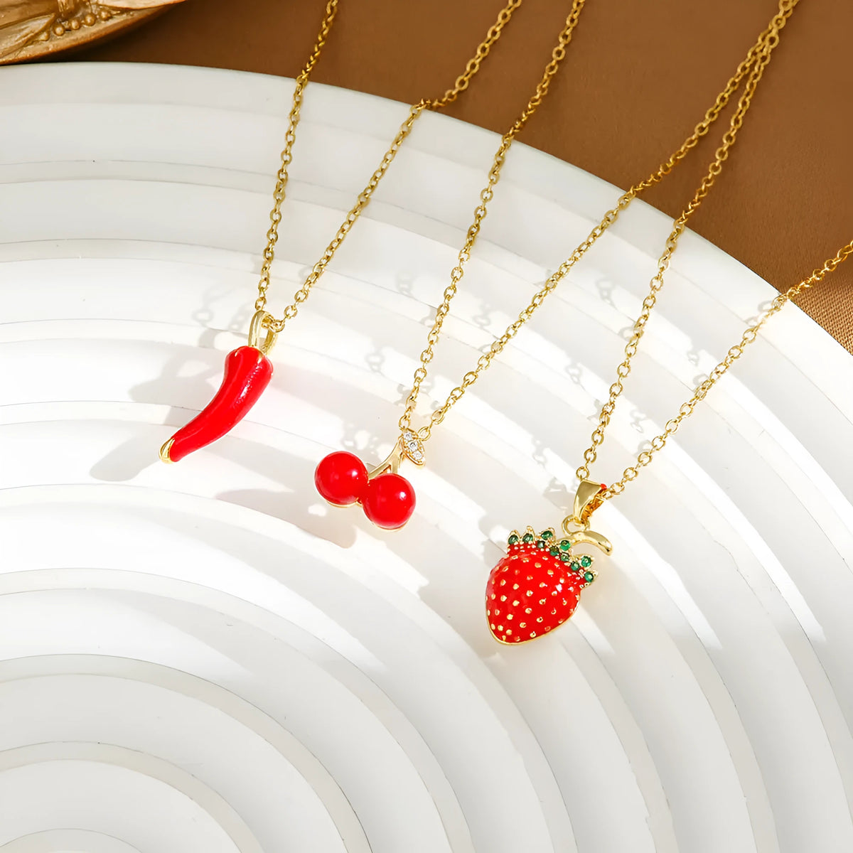 Women's titanium steel necklace with detailed pepper, strawberry and cherry pendants on O-ring chain