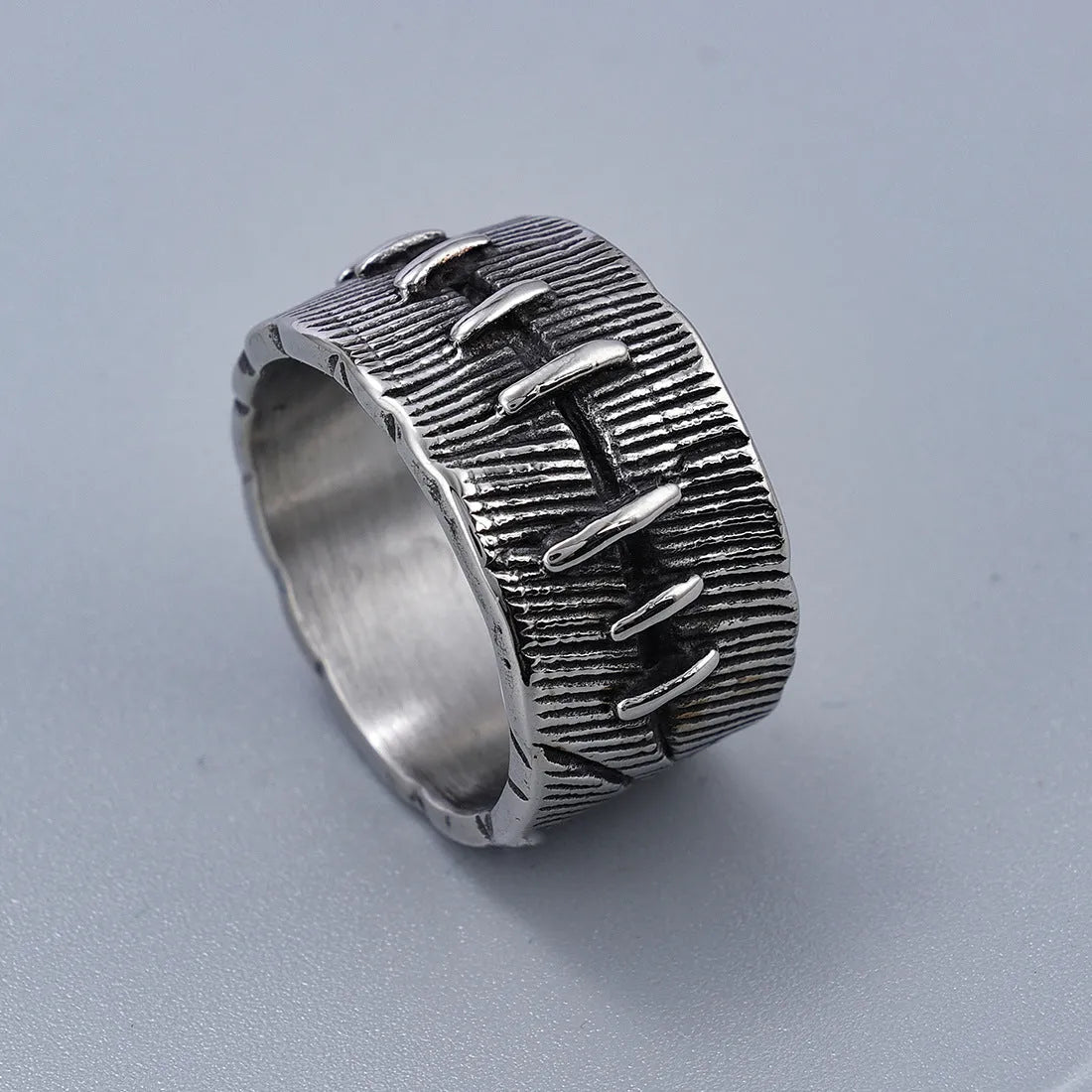 Geometric titanium steel double ring with stitched detail in dark retro colour