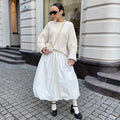 Women's long cotton skirt in solid black or white colour for casual wear.