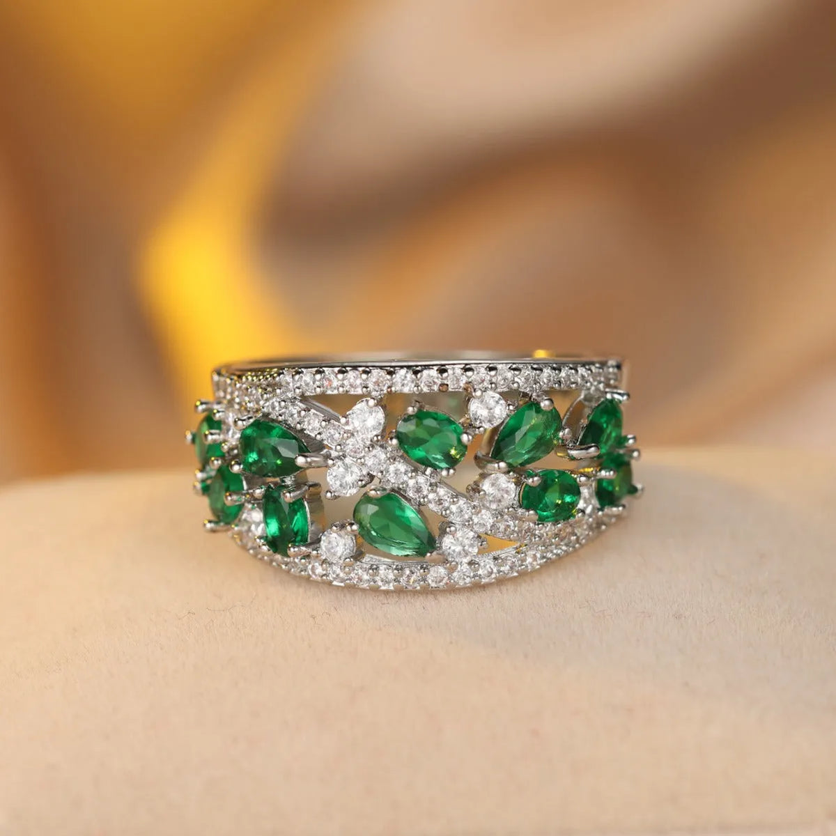 Women's round hollow fashion ring in gold or platinum plating with a blue or white cubic zirconia stone.