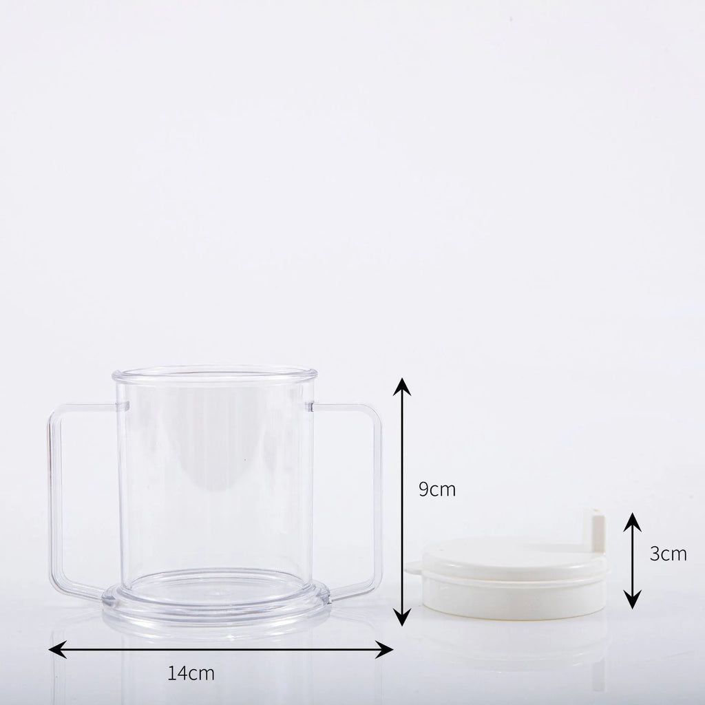 Transparent spill-proof plastic drinking cup on a table.