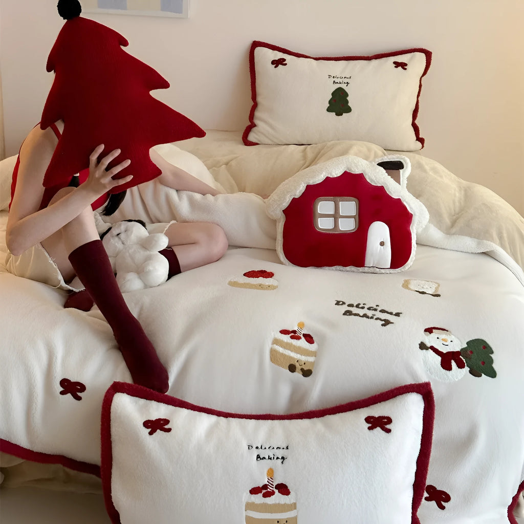Girl's Christmas-themed heart cartoon pattern bedding four-piece set with a duvet cover, sheet, and pillowcases.