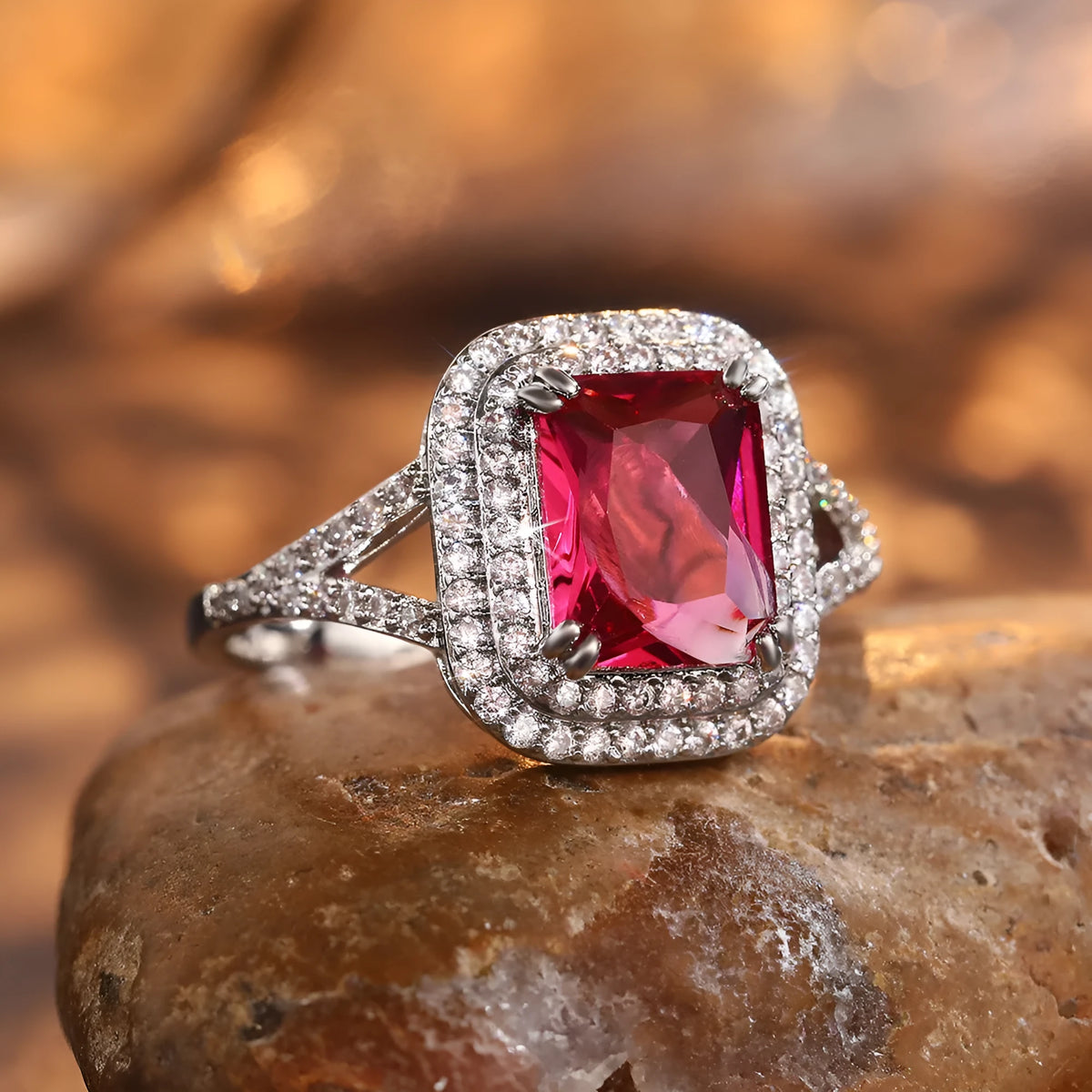 Red geometric square copper women's ring with rhinestone detailing on a white background.
