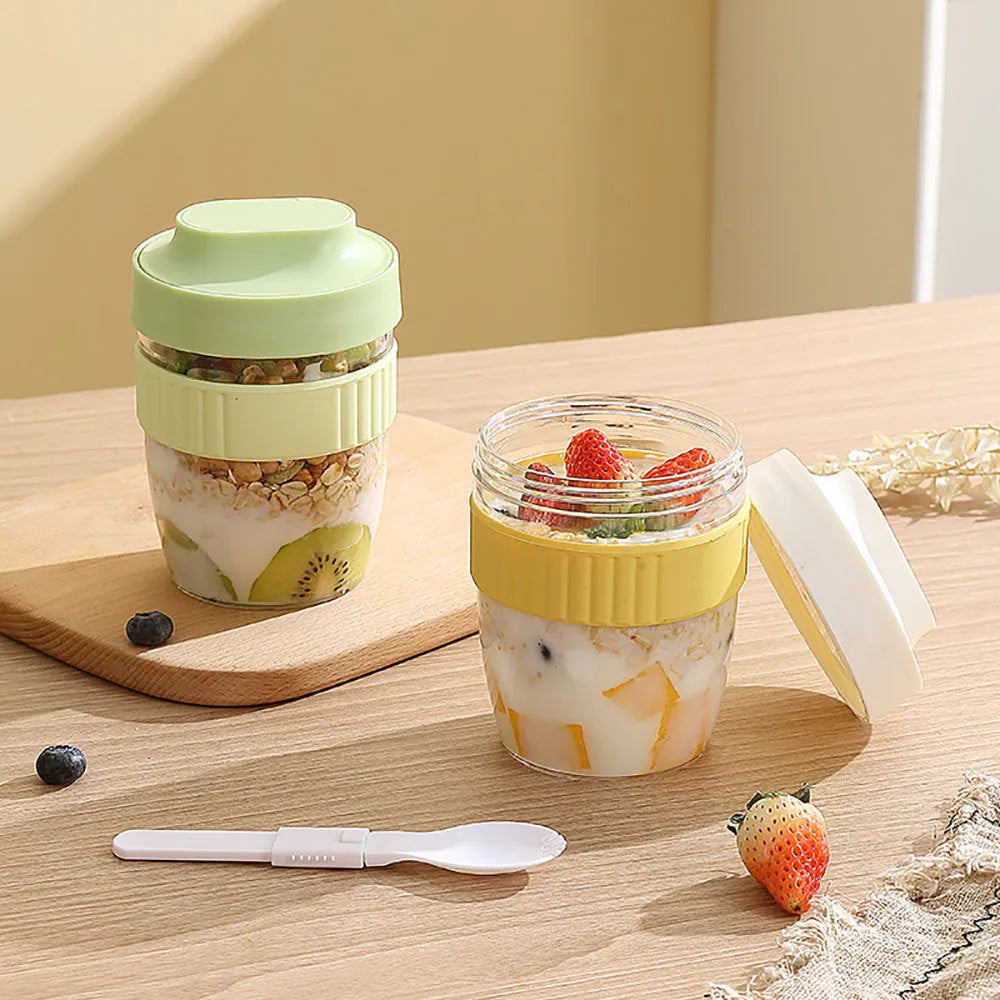 Green plastic salad cup with integrated spoon and lid showing seal and leak-proof design