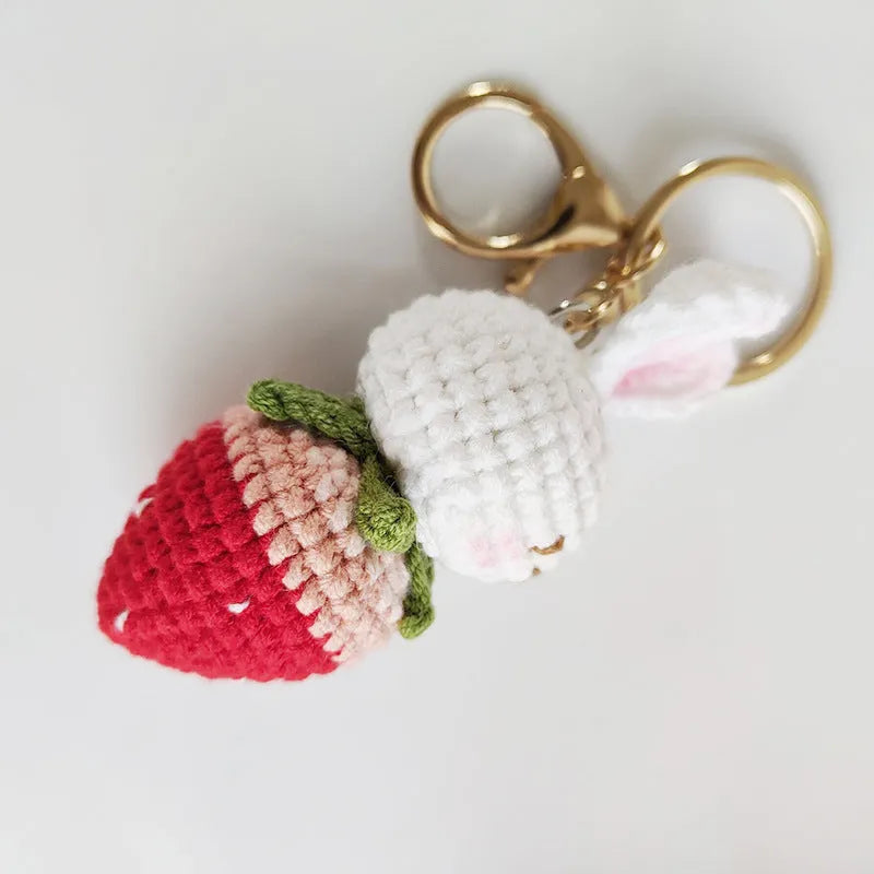 White hand-woven rabbit strawberry pendant charm with key detail made from doll wire.