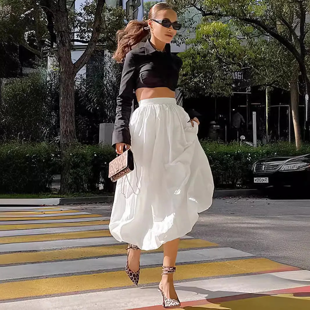 Women's long cotton skirt in solid black or white colour for casual wear.
