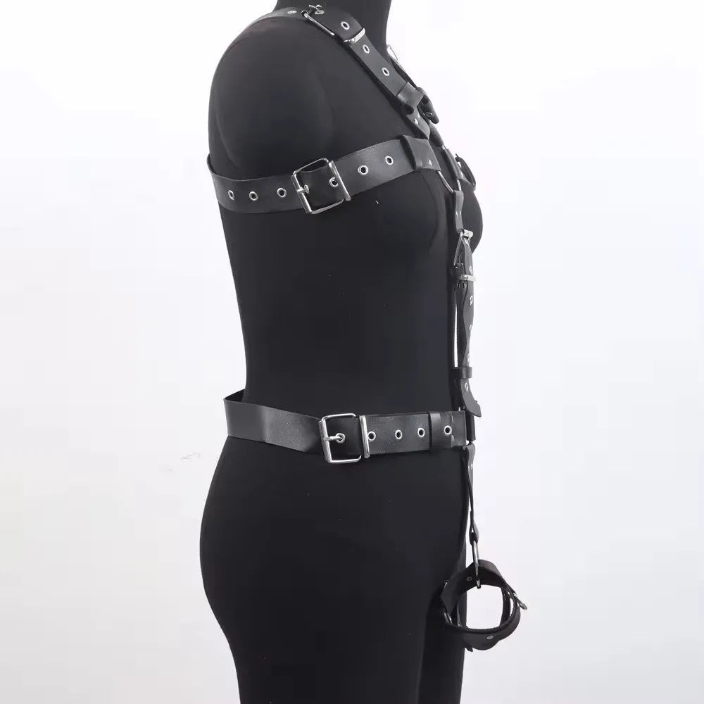 Black patent leather bondage body harness with thin straps and a pin buckle.