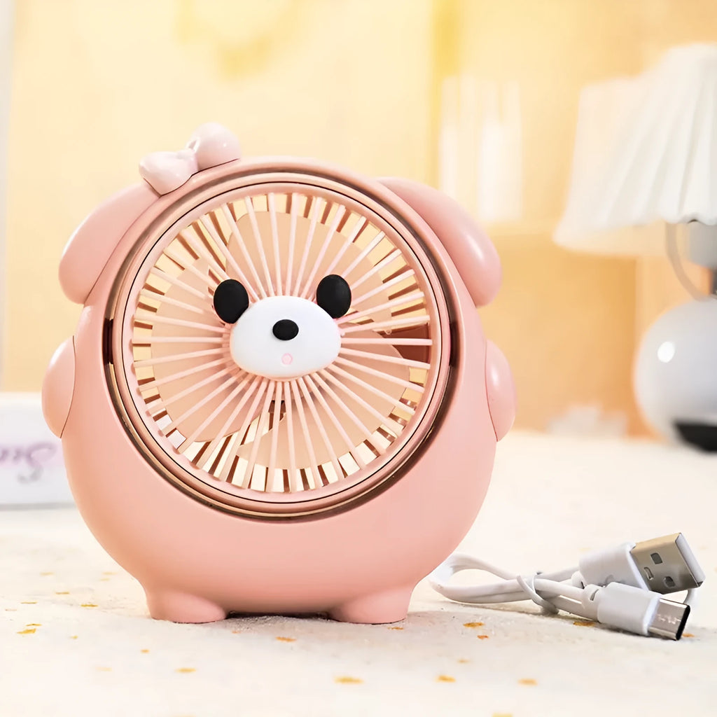 Cute dog-themed USB desktop electric fan in one of six available colours on a desk.
