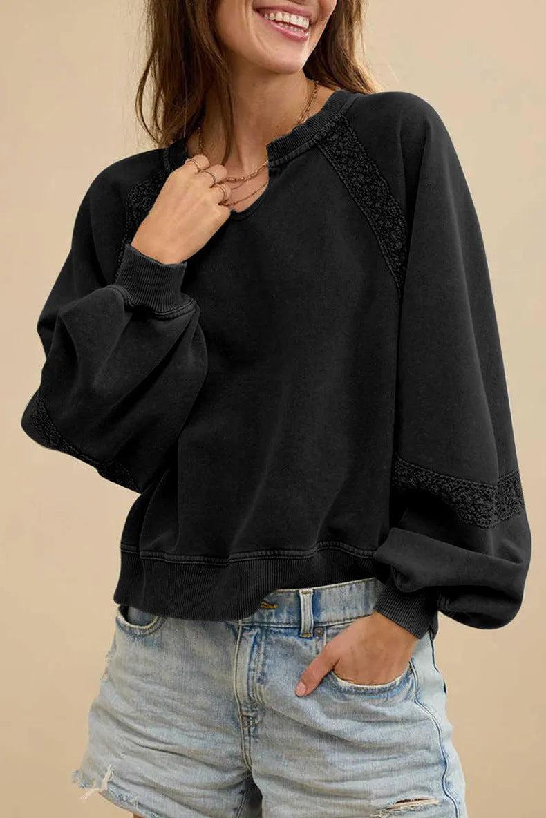 Women's solid colour loose fit long sleeve sweater with a half-open collar and lace stitching detail.