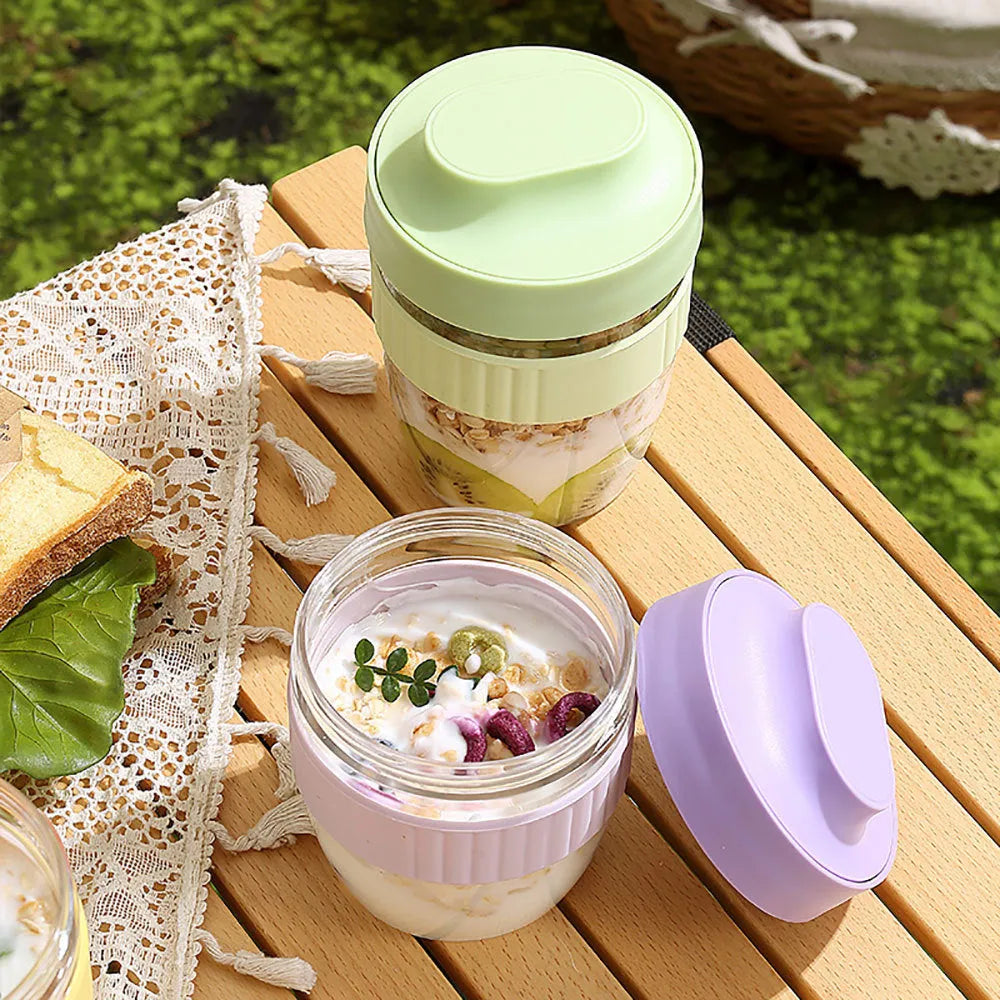 Green plastic salad cup with integrated spoon and lid showing seal and leak-proof design