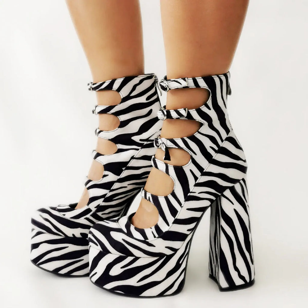 Women's black patent leather waterproof platform high heels with a thick heel and a serpentine ankle strap buckle.