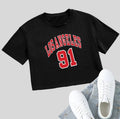 A loose fit black cotton T-shirt with white printed English letters and an exposed navel cut.
