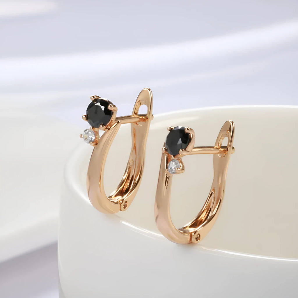 Gold geometric drop earrings with black stone inlay, retro style for women.