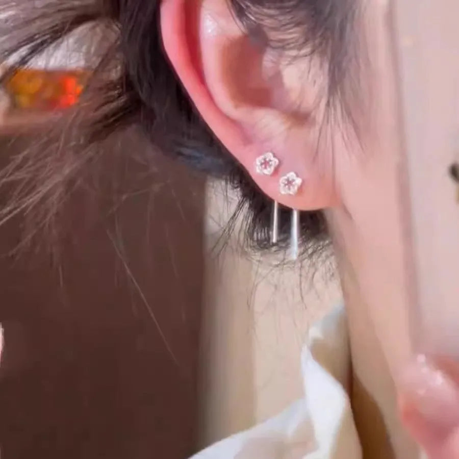 Sterling silver needle hollow flower hanging earrings with silver colour petal design
