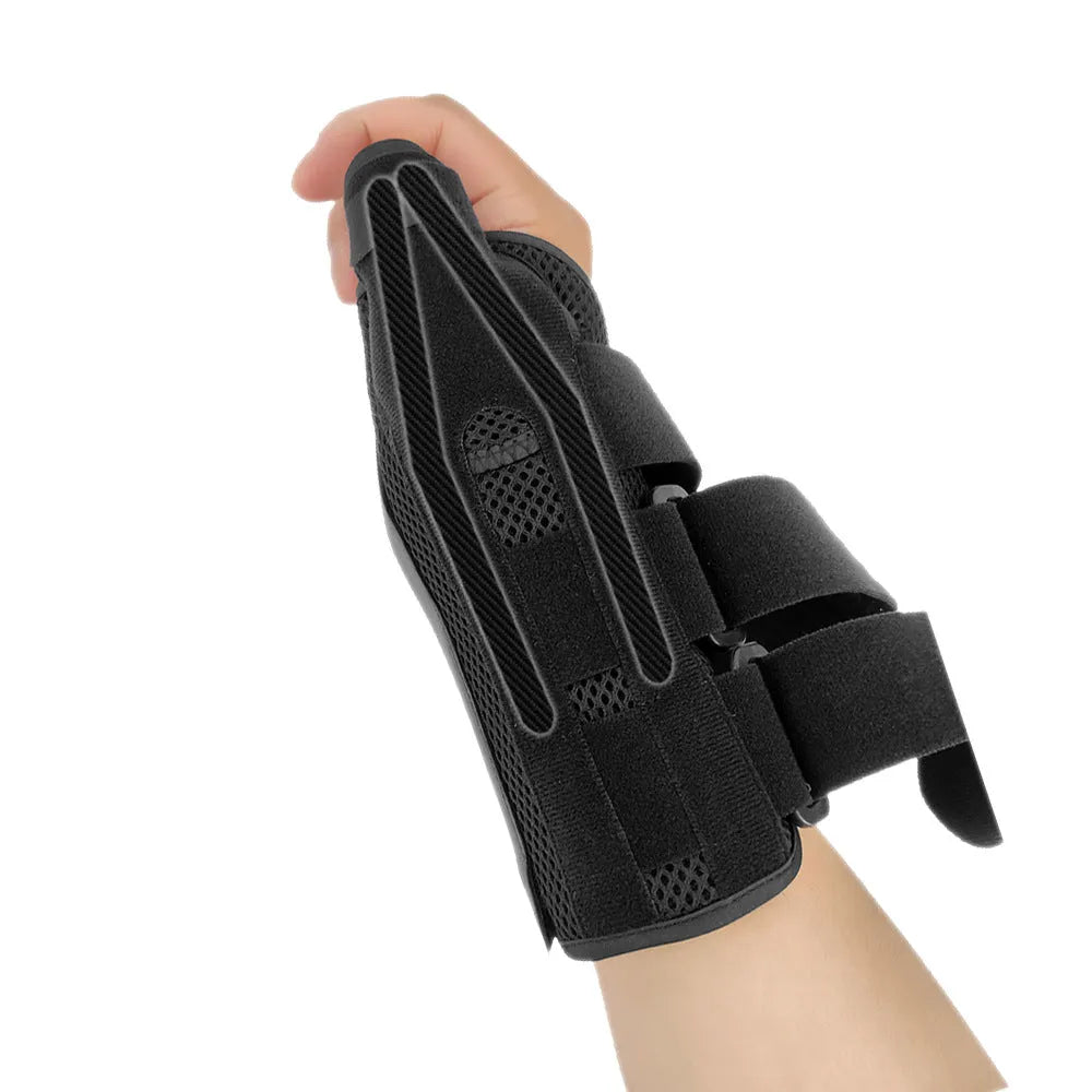 Black sports wrist guard with carbon fibre panel and grey thumb strap for left hand support