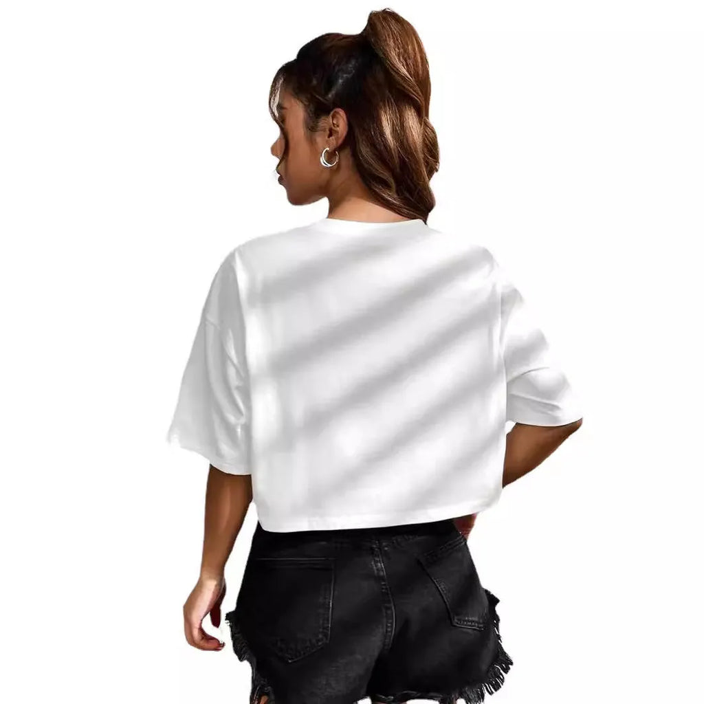 A loose fit black cotton T-shirt with white printed English letters and an exposed navel cut.
