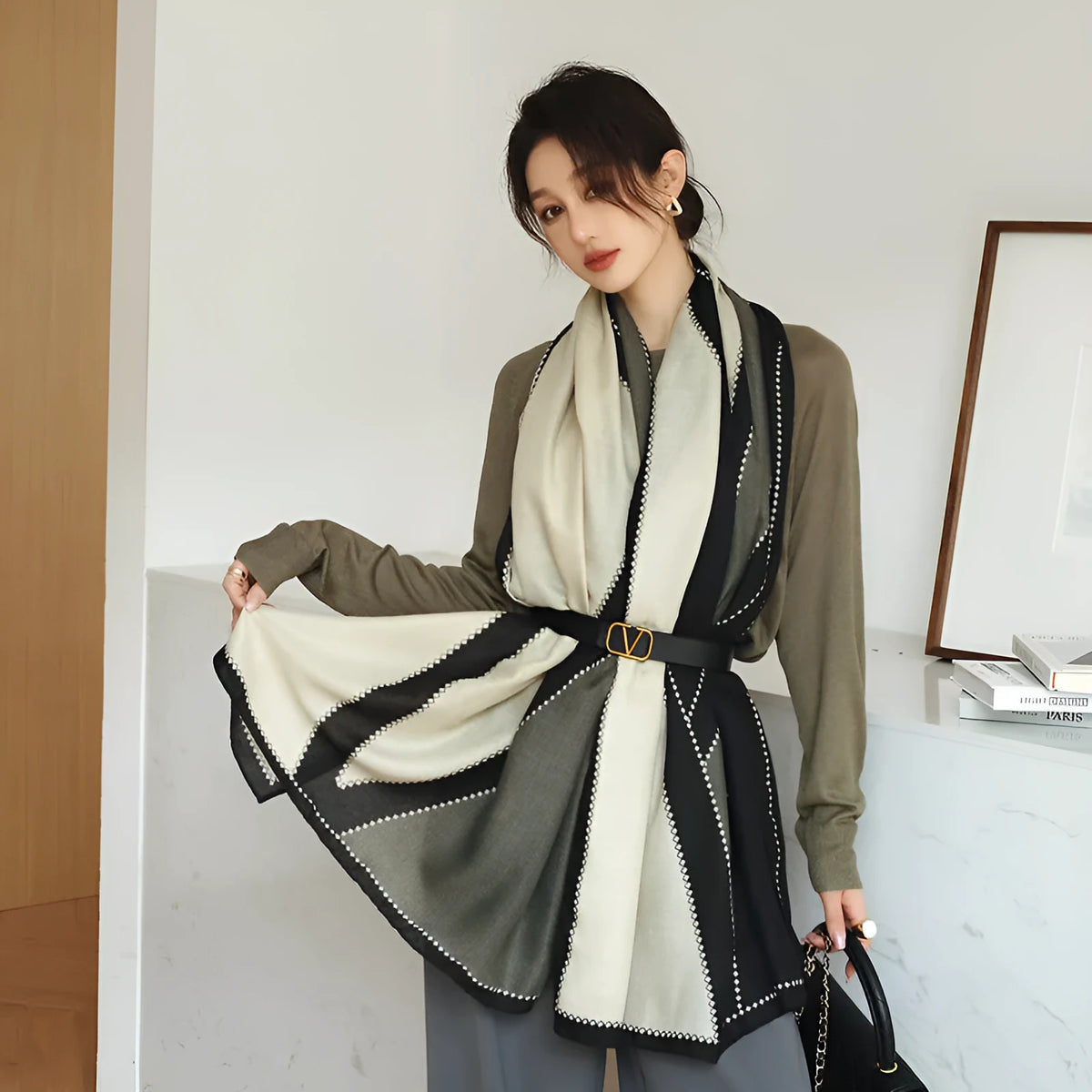 A woman wearing a printed polyester scarf, showing one of three style options, with dimensions of 180cm by 90cm.