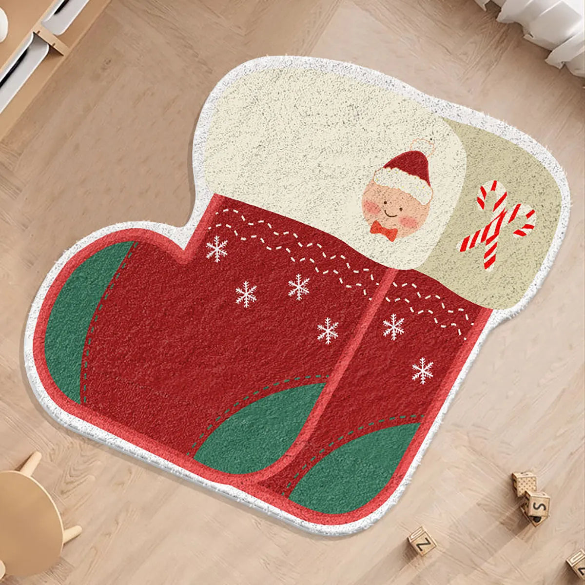 Round Christmas carpet with imitation cashmere material in festive colour design on wooden floor