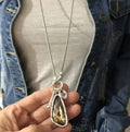 Women's long geometric pendant necklace with snake bone chain in blue, champagne or grey colour
