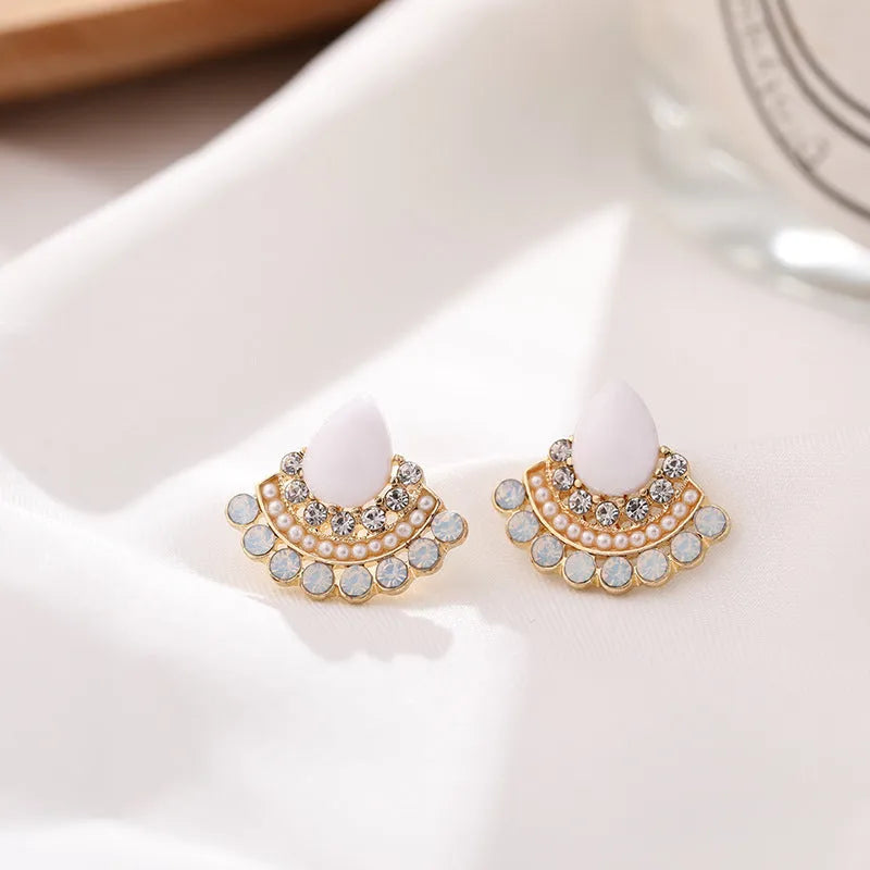 Women's silver retro fan-shaped earrings with opal centre and rhinestone detailing on geometric design
